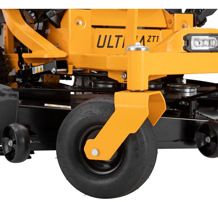 Close-up of a yellow lawn mower with 'ULTIMA' branding on a white background