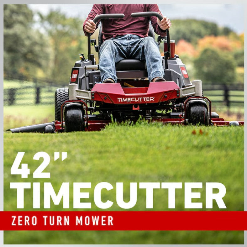 Person operating a red Timecutter zero turn mower on a grassy field.