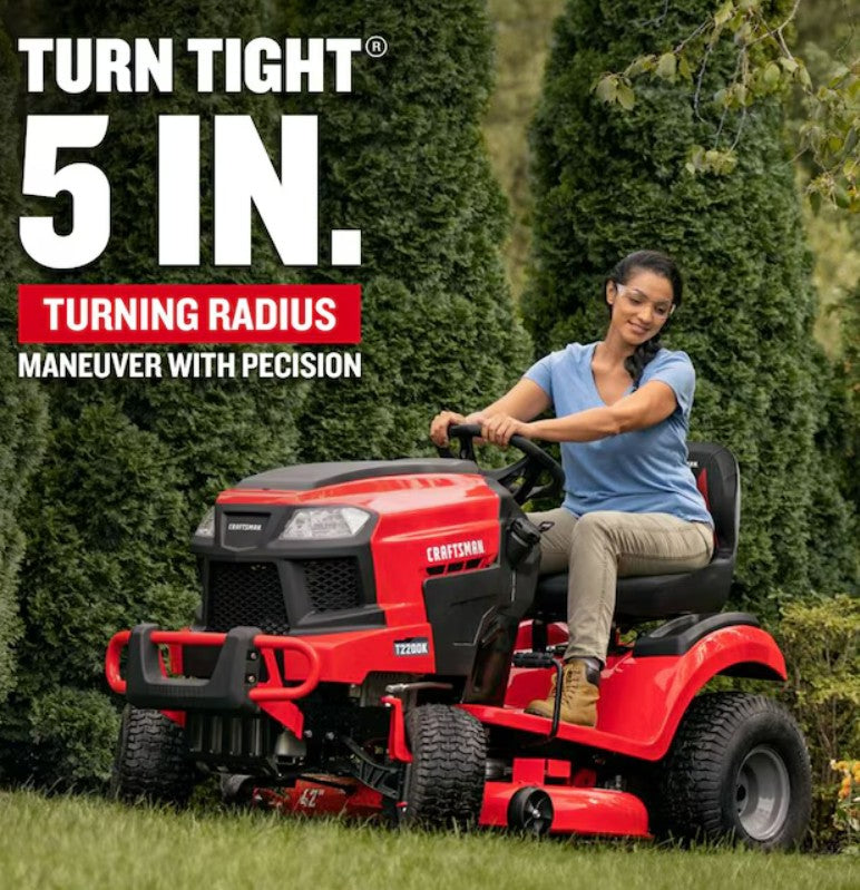 Person operating a red riding lawn mower with text highlighting turning radius, set against a green outdoor background.

