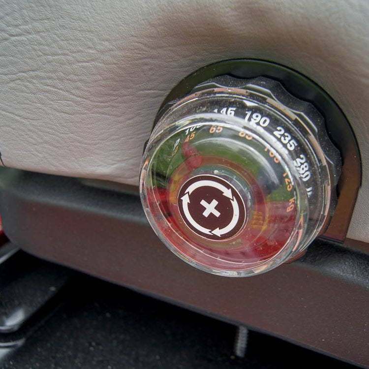 Car air freshener with a clear cover on a car dashboard