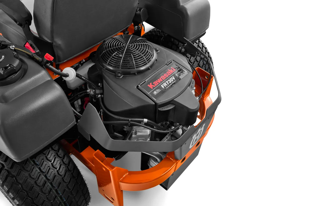 Close-up of a Kawasaki engine on a lawn mower with a white background

