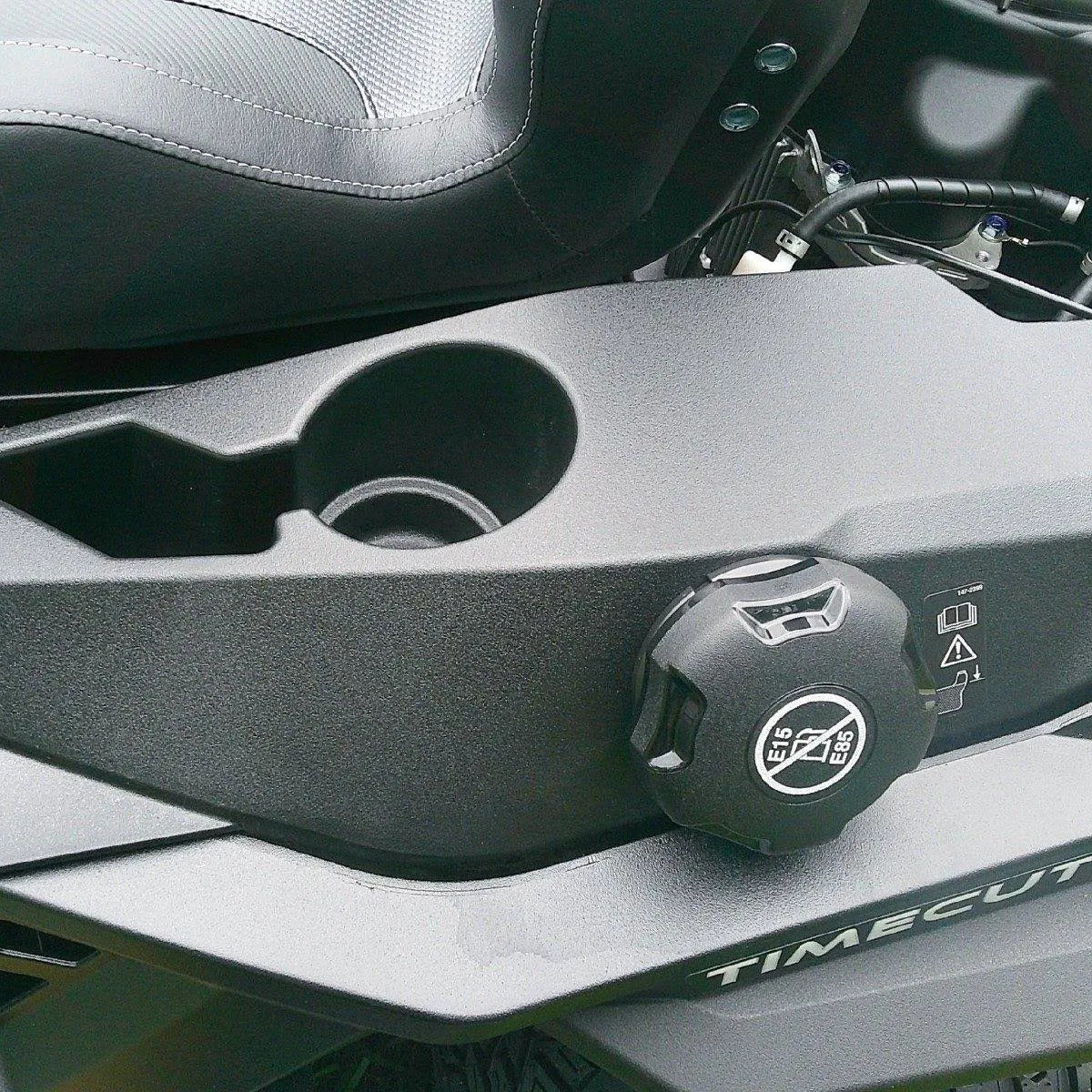 Close-up of a motorcycle's handlebar with 'TimeSculpted' branding.

