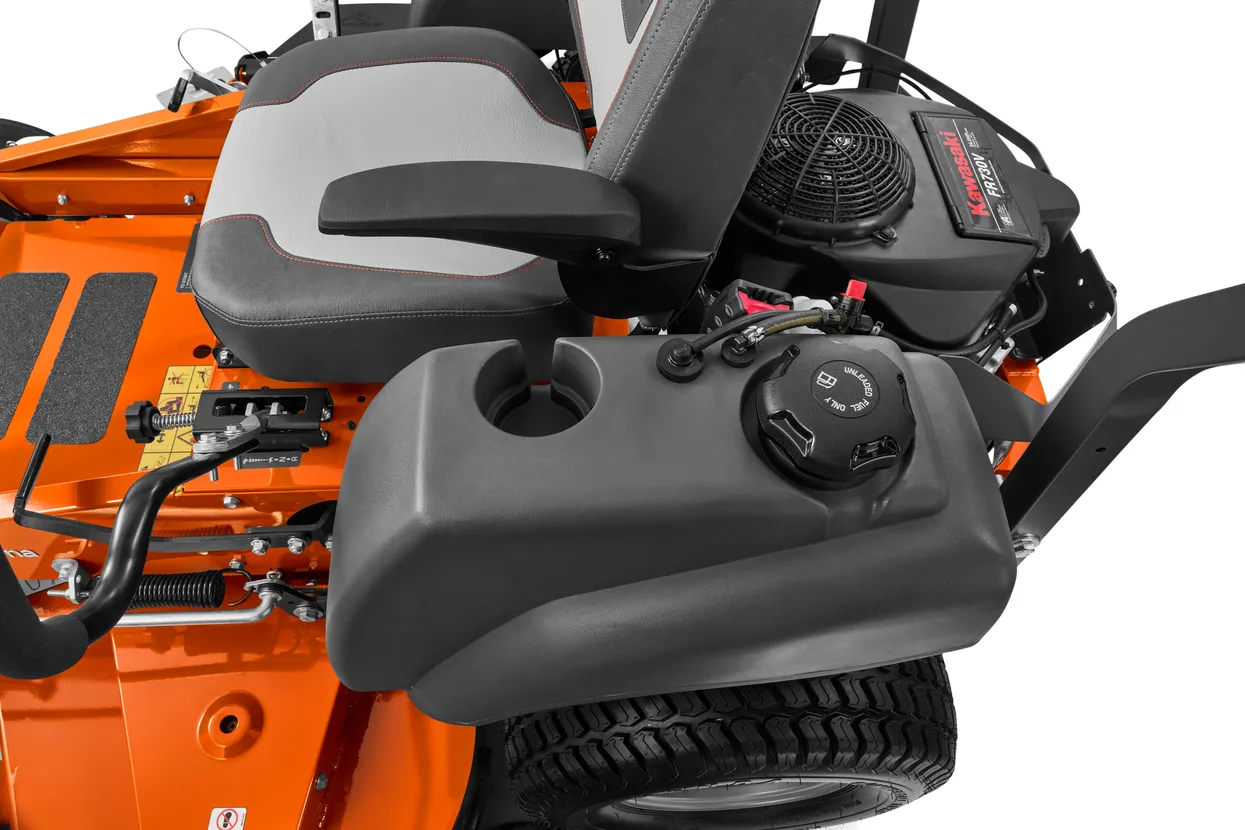 Close-up of a lawn mower engine and seat on a white background


